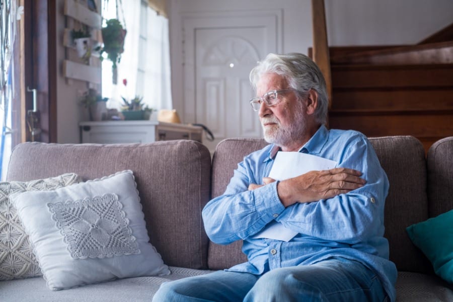 A man alone in his home with parkinson's disease