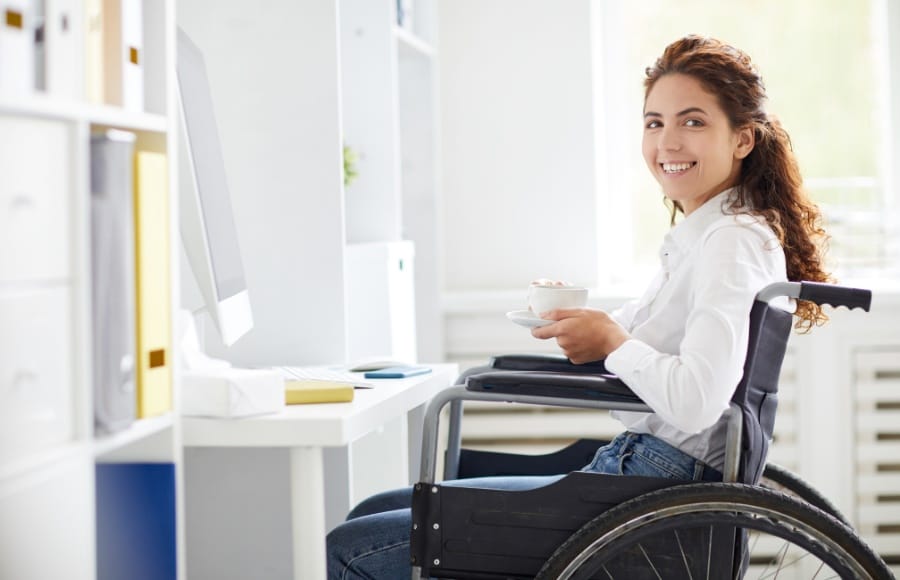 Woman in a wheelchair who has a concierge nurse