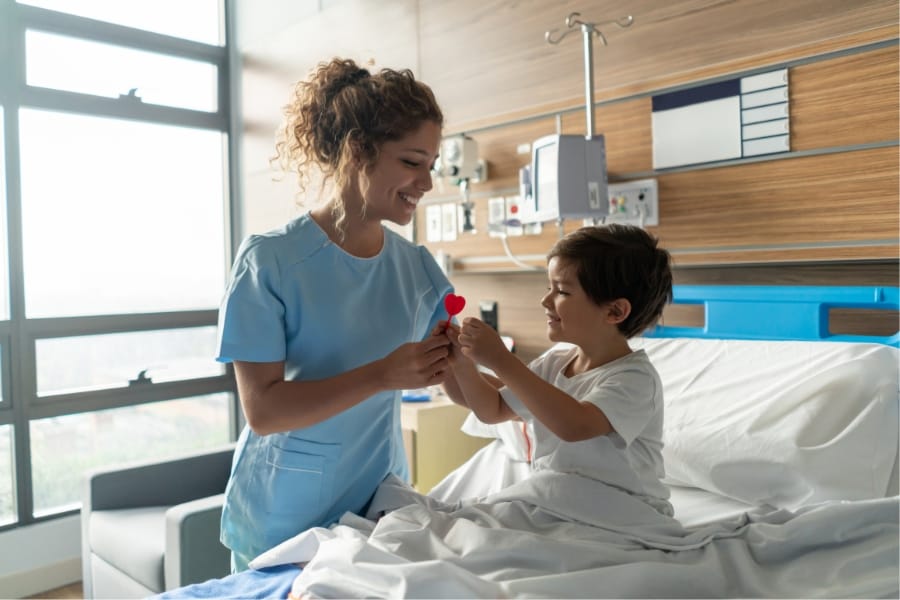 Nurse and her young patient at a healthcare facility in Fresno, California