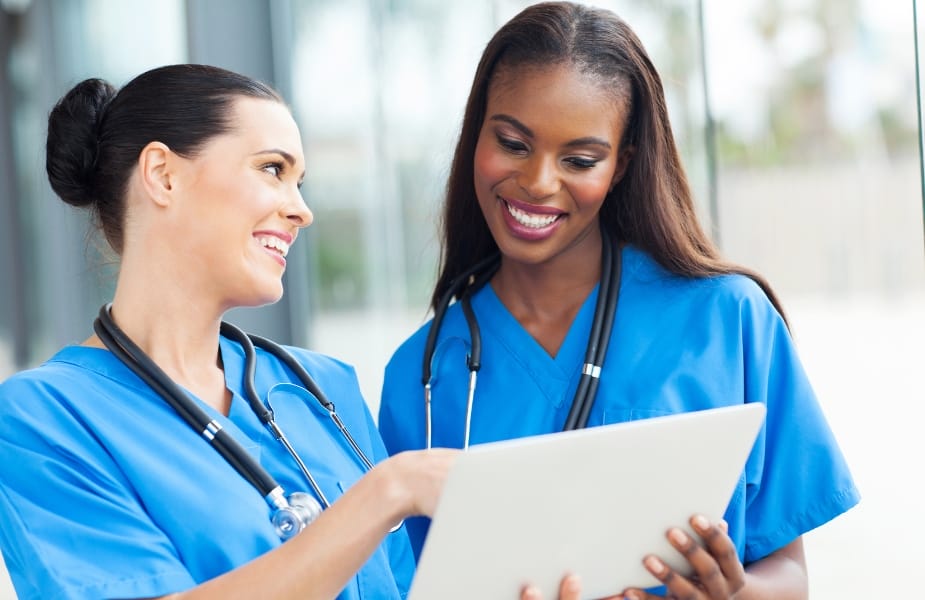 nurses discussing a patient's chart