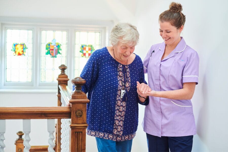 Private nurse assisting her elderly client