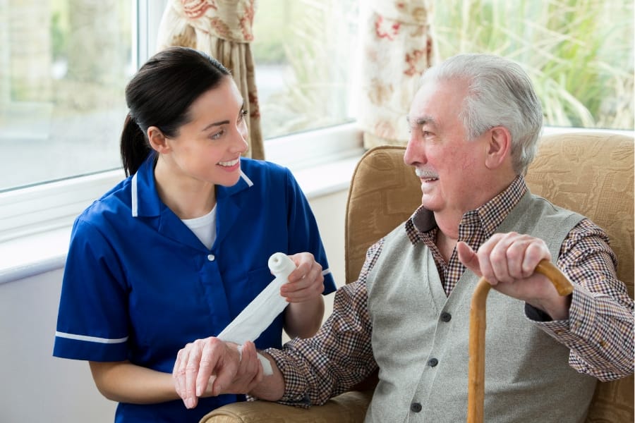 Client receiving wound care after surgery