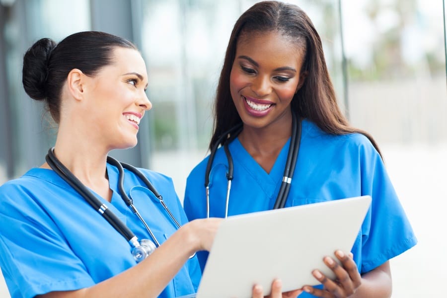 a nurse helping her colleague