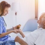 Patient receiving medication after his surgery