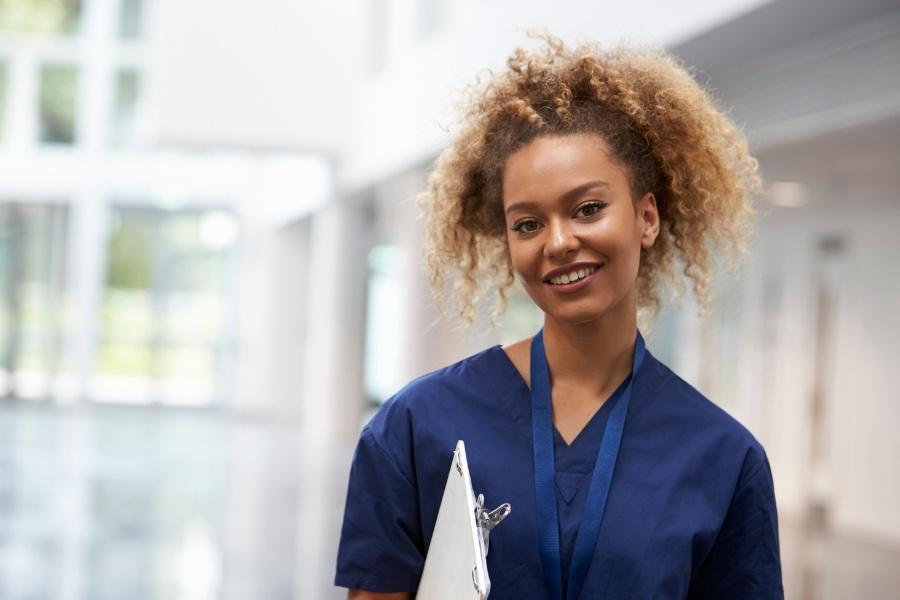 Smiling nurse in a healthcare facility in Riverside, CA