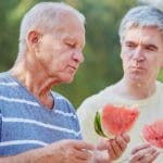 A man with Parkinson's Disease having difficulty swallowing