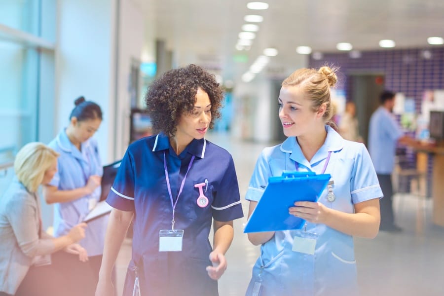 two nurses talking