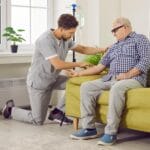 Private nurse doing an infusion for an elderly man