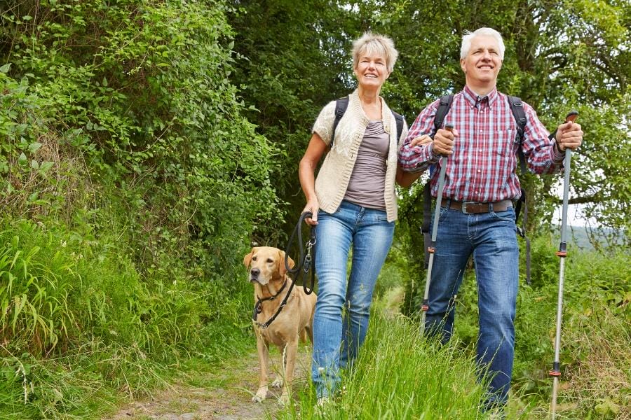 Elderly couple with PD on a walk