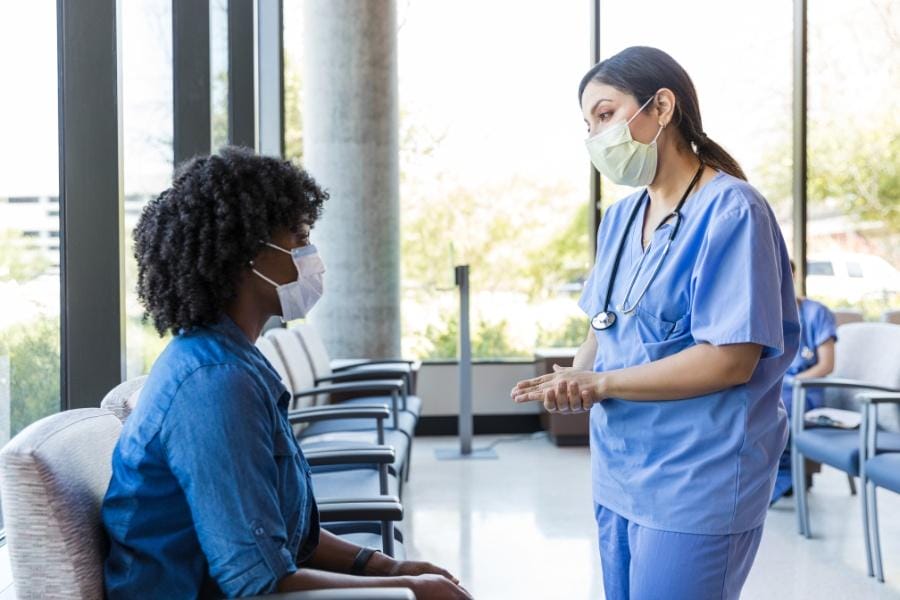 A nurse giving life-altering news to a patient