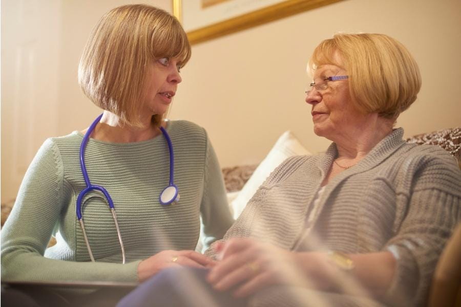 an empathy nurse talking to a patient