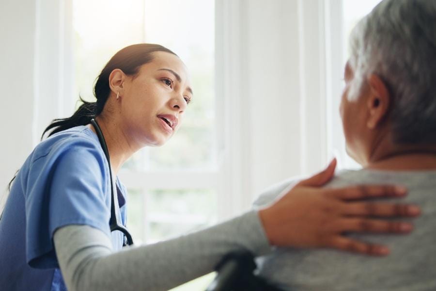 a nurse giving a patient bad news