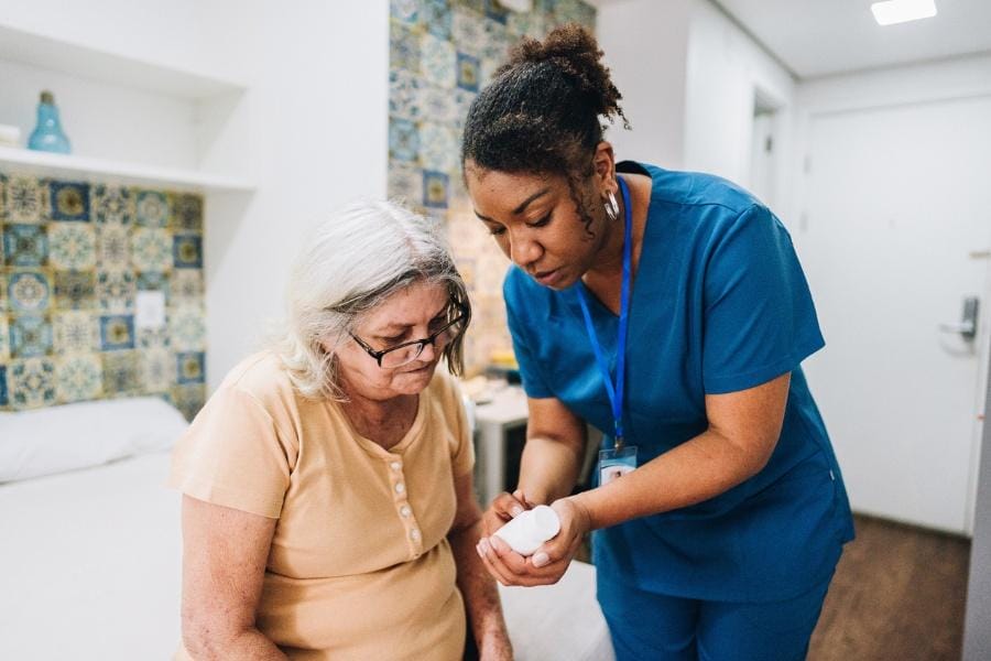 LPN assisting a client with medication