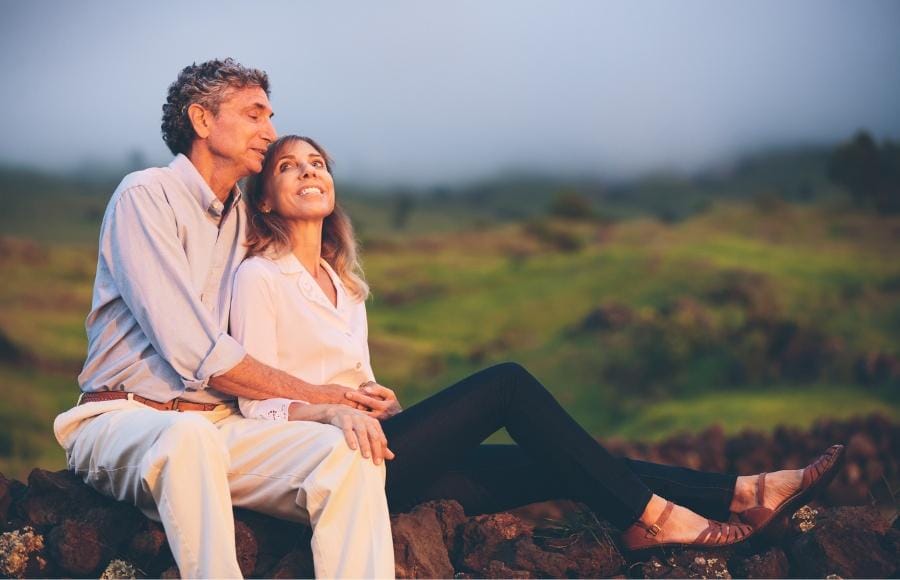 Middle-aged couple outside smiling