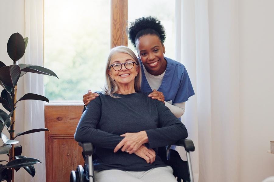 A happy patient and her at home nurse