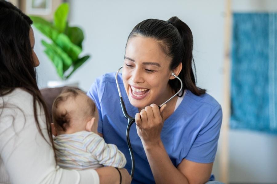 nighttime nurse offering newborn education and care