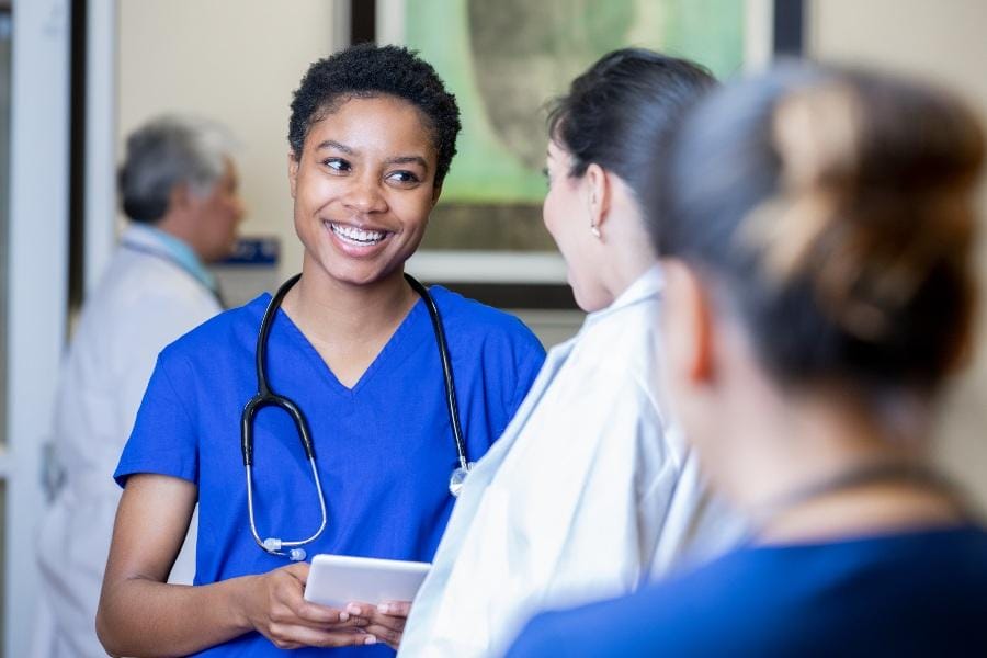 Nurse smiling at a medical facility