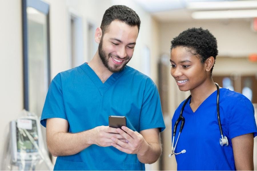 two nurses working at a healthcare facility