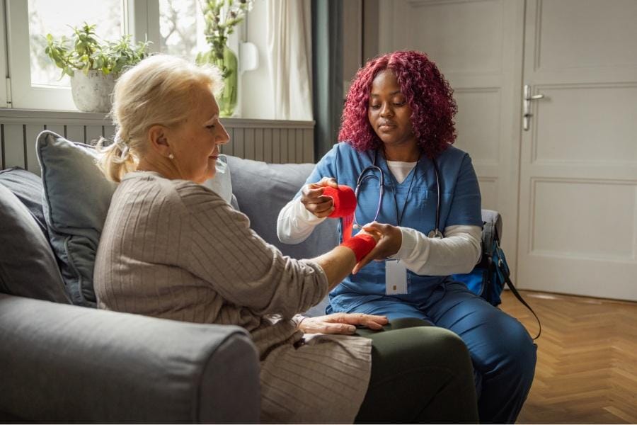 post op nurse offering wound care to a client