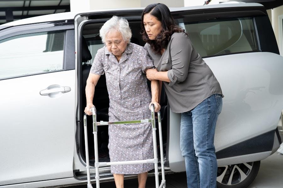 A woman with Multiple Sclerosis receiving transportation services