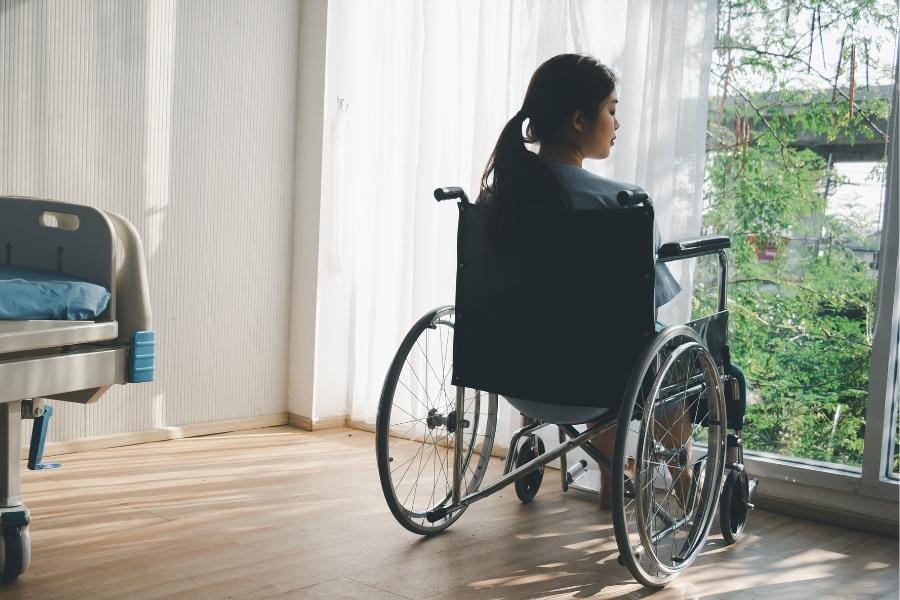 A woman with MS in a wheelchair